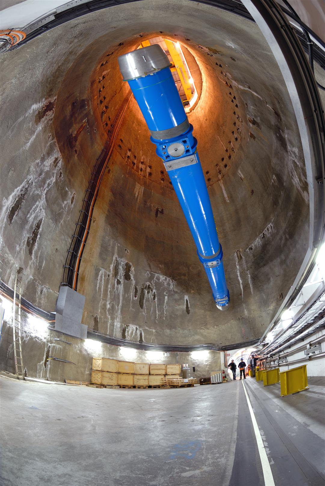 The last of 1746 superconducting magnets is lowered into the LHC tunnel via a specially constructed pit at 12:00 on 26 April. This 15-m long dipole magnet is one of 1232 dipoles positioned around the 27-km circumference of the collider. Dipole magnets produce a magnetic field that bends the particle beams around the circular accelerator.